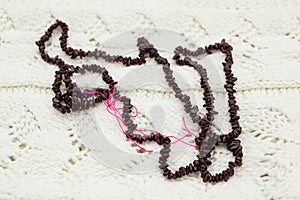 Garnet beads on the knit