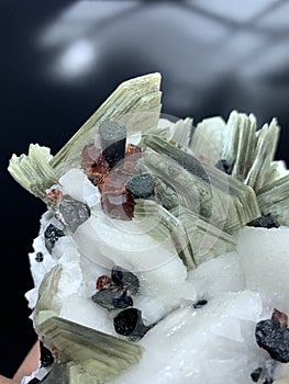 Garnet with tourmaline schorl muscovite mica albite mineral specimen crystal