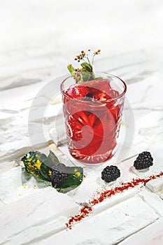 Garnished cocktail on white background