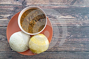 Garri and Pounded Yam served with Ogbono Soup ready to eat photo