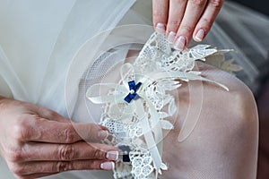 Garter on the leg of a bride, Wedding day moments