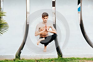 Garudasana, the eagle yoga pose, balancing postures for expert yoga practitioners