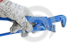 Gas adjustable wrench in a man`s hand in a working glove. Locksmith tool