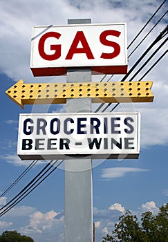 Gas, Beer and Grocery Sign with Blue Sky and Clouds in Background