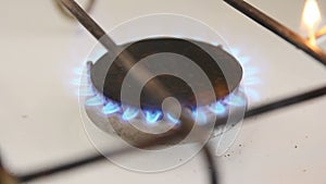 Gas burner with a blue flame.