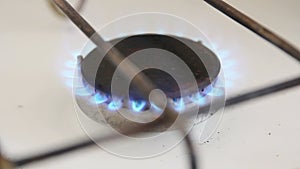 Gas burner with a blue flame.