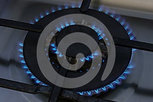 Gas burner flame at gas stove, close-up.