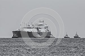 GAS CARRIER, ESCORTED BY TUGS