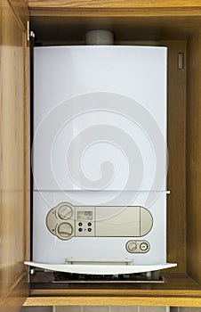 Gas central heating condensing boiler fitted inside a cabinet