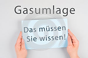 Gas commission is standing in german language on the paper, new fee regualtion in Germany, risk for impoverishment