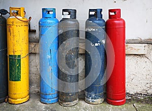 Gas cylinder. Industrial propane butane bombs. Row dirty gas cylinders.