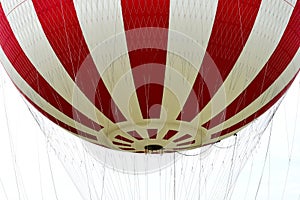 gas filled isolated red and white striped adventure balloon detail. hovering over Budapest. closeup view