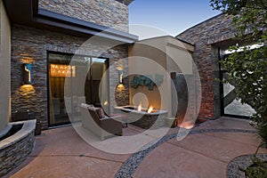 Gas Fire Pit And Sofa In Courtyard