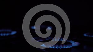 Gas flame with bright small sparks delivering from burners