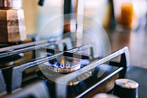 Gas flames burning on kitchen stove top