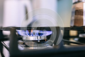 Gas flames burning on kitchen stove top