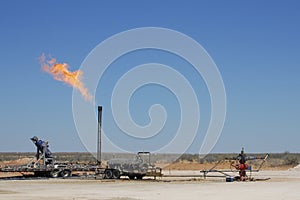 Gas flare at a well in the west Texas oilfield