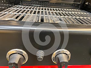 Gas grill. Gas grill grate. Metal grill.