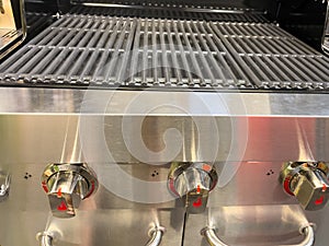 Gas grill. Gas grill grate. Metal grill.