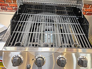 Gas grill. Gas grill grate. Metal grill.