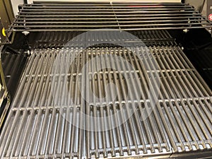 Gas grill. Gas grill grate. Metal grill.