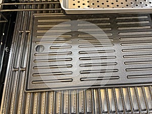 Gas grill. Gas grill grate. Metal grill.