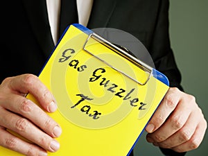 Gas Guzzler Tax  sign on the piece of paper