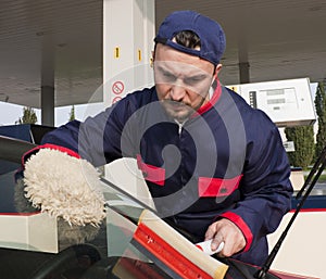 Gas Jockey Cleaning Windshield