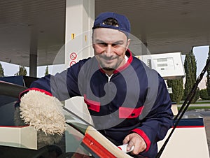 Gas Jockey Cleaning Windshield