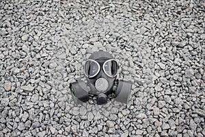 Gas mask on stone background