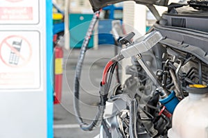 Gas nozzle to add gas in car at gas station