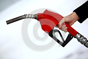 Gas nozzle in woman's hand