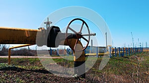Gas and oil industry. Pipeline with a large shut-off valve. Station for processing and cleaning oil and gas. Production