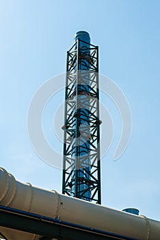 Gas pipe against the blue sky.