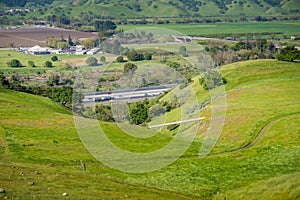 Gas Pipeline going through verdant hills alongside a highway, San Jose, California