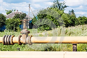 Gas pipeline in village in summer day