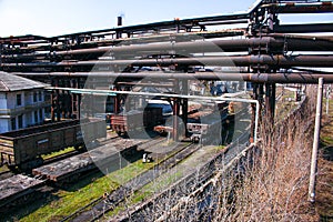 Gas pipelines at a metallurgical plant against the blue sky. Concept of economic crisis. Ecology concept