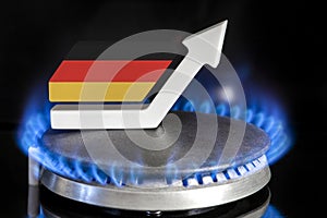 Gas price. Rise in gas prices in Germany. A burner with a flame and an arrow up, painted in the colors of the Germany