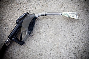 Gas pump with money in the nozzle