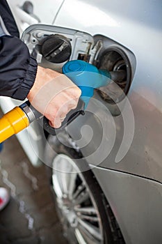 Gas pump nozzles at gas station