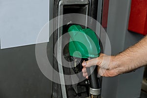 Gas pump nozzles in a service station for refueling car on gas station
