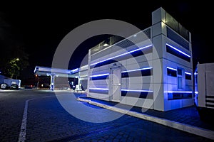 A gas station in blue night colors