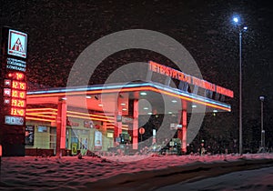 Gas station at night in winter