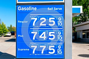 Gas station price sign showing high gasoline price for over 7 dollars a gallon of regular gas