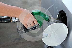 Gas Station Refill Hand and Nozzle