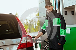 Gas station worker looking at camera
