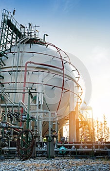 Gas storage sphere tank in morning at petrochemical plant