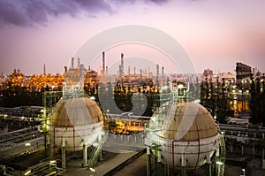 Gas storage sphere tank petrochemical plant at dawn