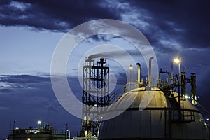 Gas storage spheres tank in petrochemical plant at night