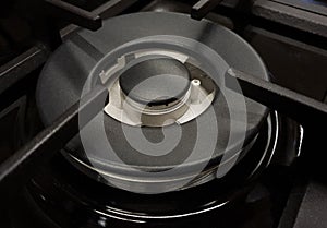 A gas stove burner turned off